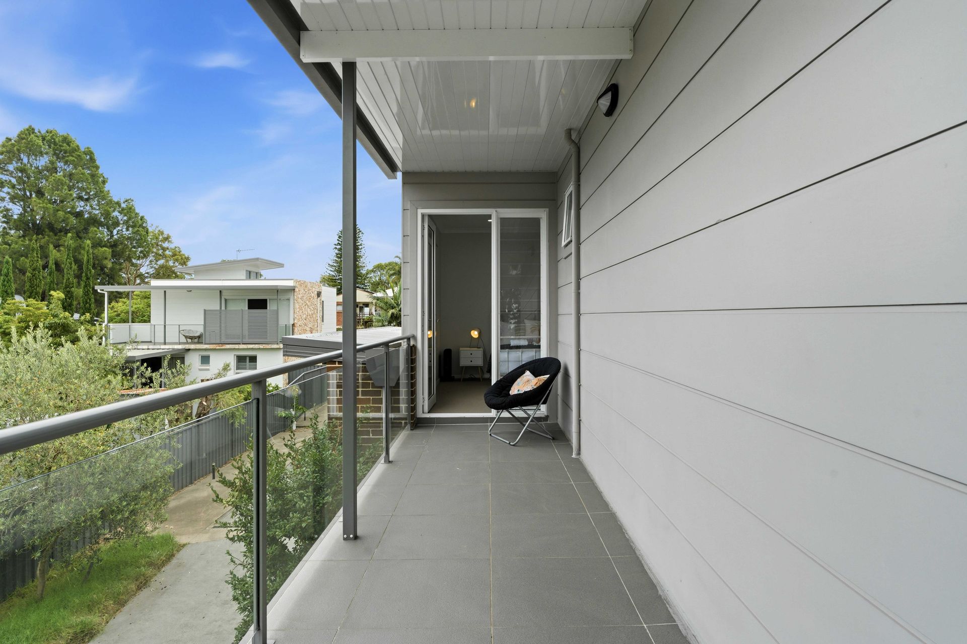 Covered walkway leading to the upstairs entry of the house