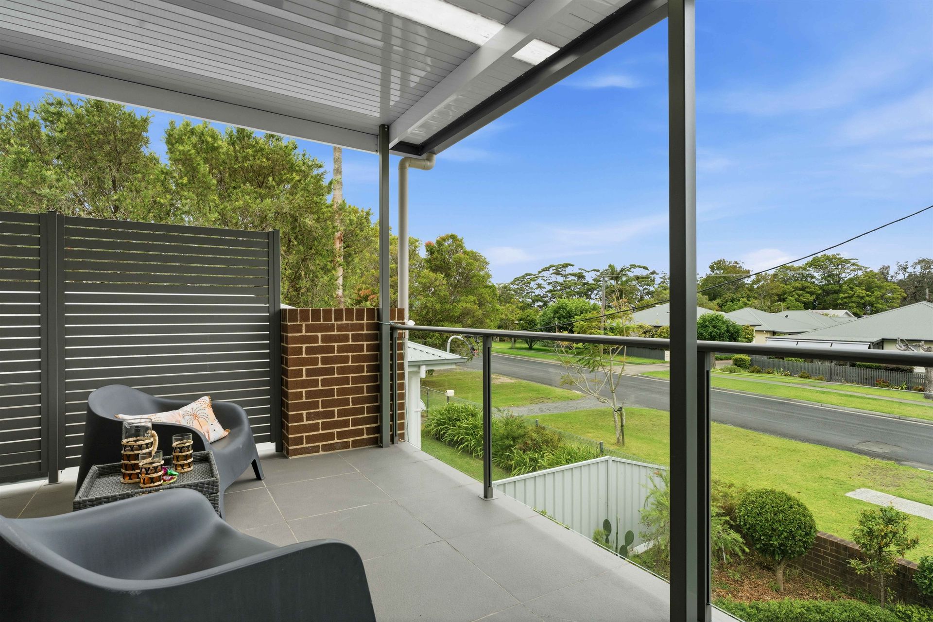 Balcony seating area looking out over the quiet Huskisson street